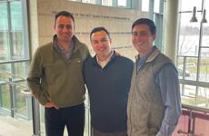 Eric Wainman, Jacob Alchek, and Connor Kozin in the MIT Sloan E62 building