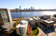 Wide shot of the MIT Sloan campus and the Charles River