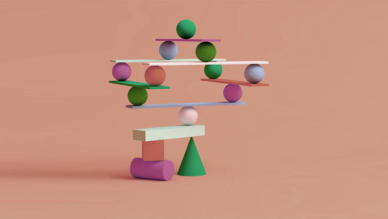 Geometric shapes balancing on one another dangerously