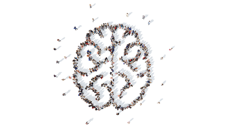 Image of a group of people arranged into the shape of a brain