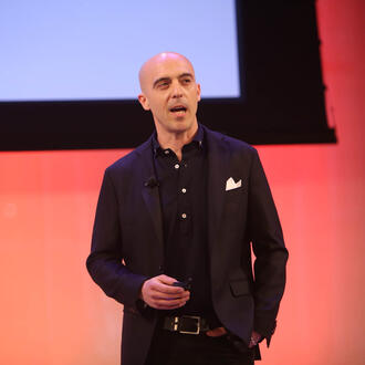 Picture of Sinan Aral speaking at a conference.