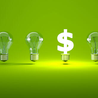 5 lightbulbs next to a lit-up dollar sign, representing venture capital funding new ideas