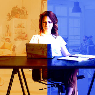 woman at desk with laptop, notebook and pen