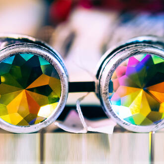 Binoculars with glass kaleidoscopes inside the lenses
