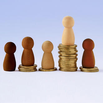 Different colored pawns on top of various stacks of coins
