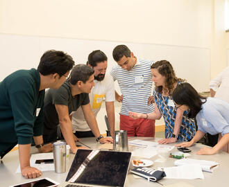 A photo of students working together in a group