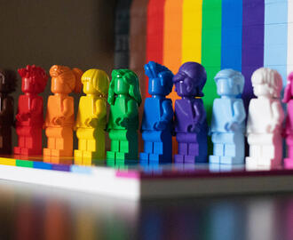 Diverse set of Lego people using rainbow colors