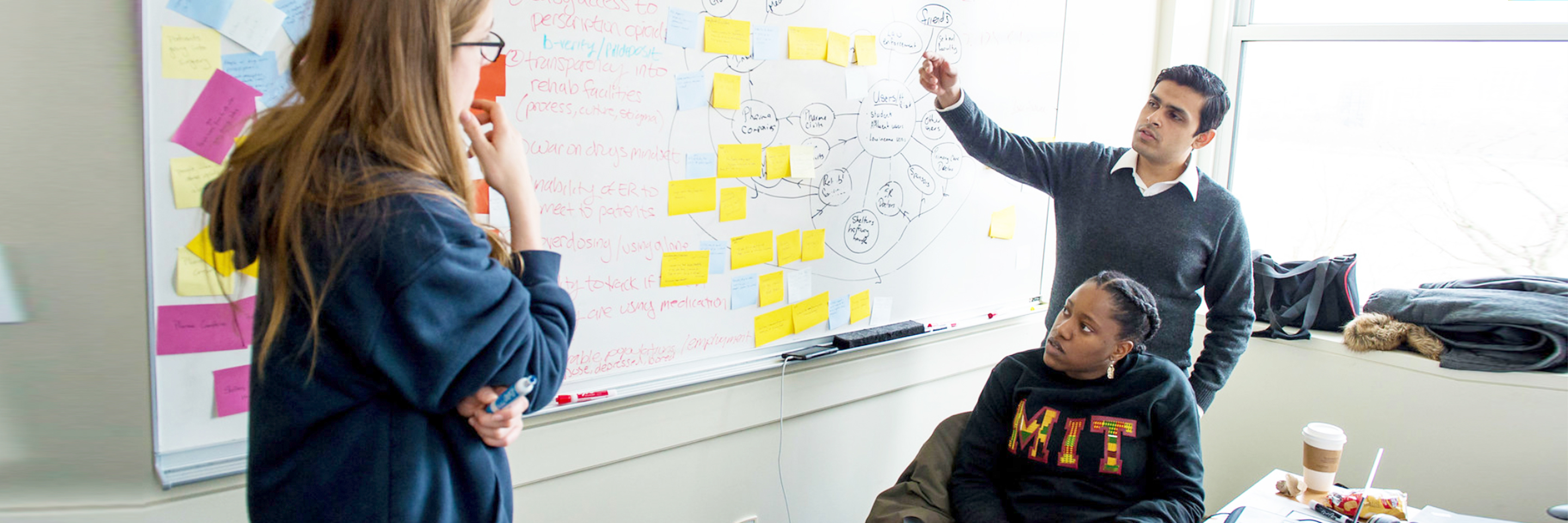 Students solving problem at hackathon