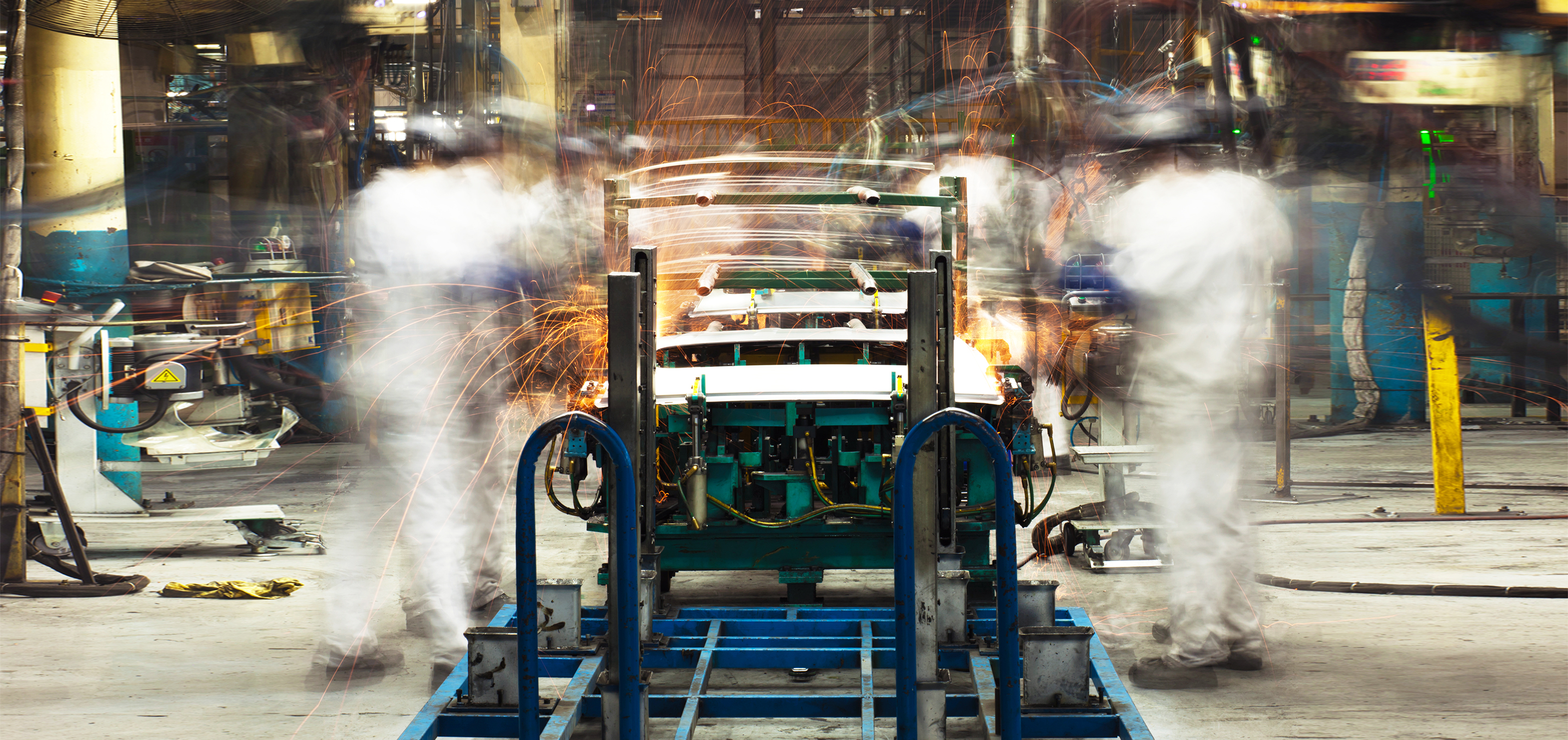 Two workers on an assembly line.