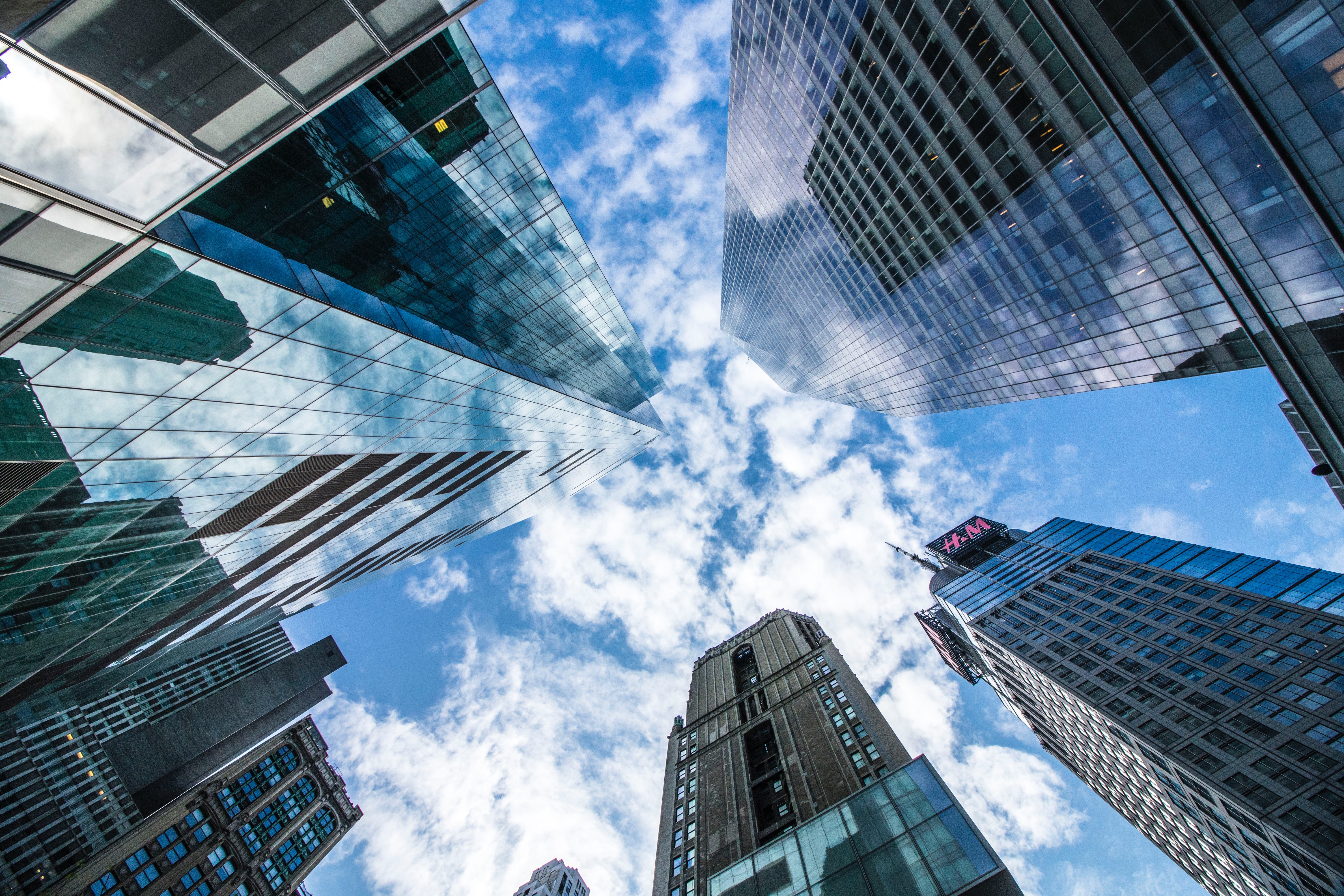 View of skyscrapers from ground level, looking up at the sky