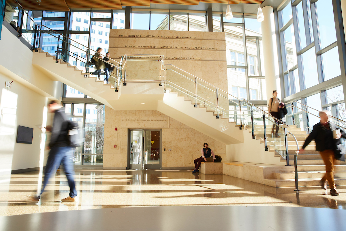MIT Sloan lobby with moving people