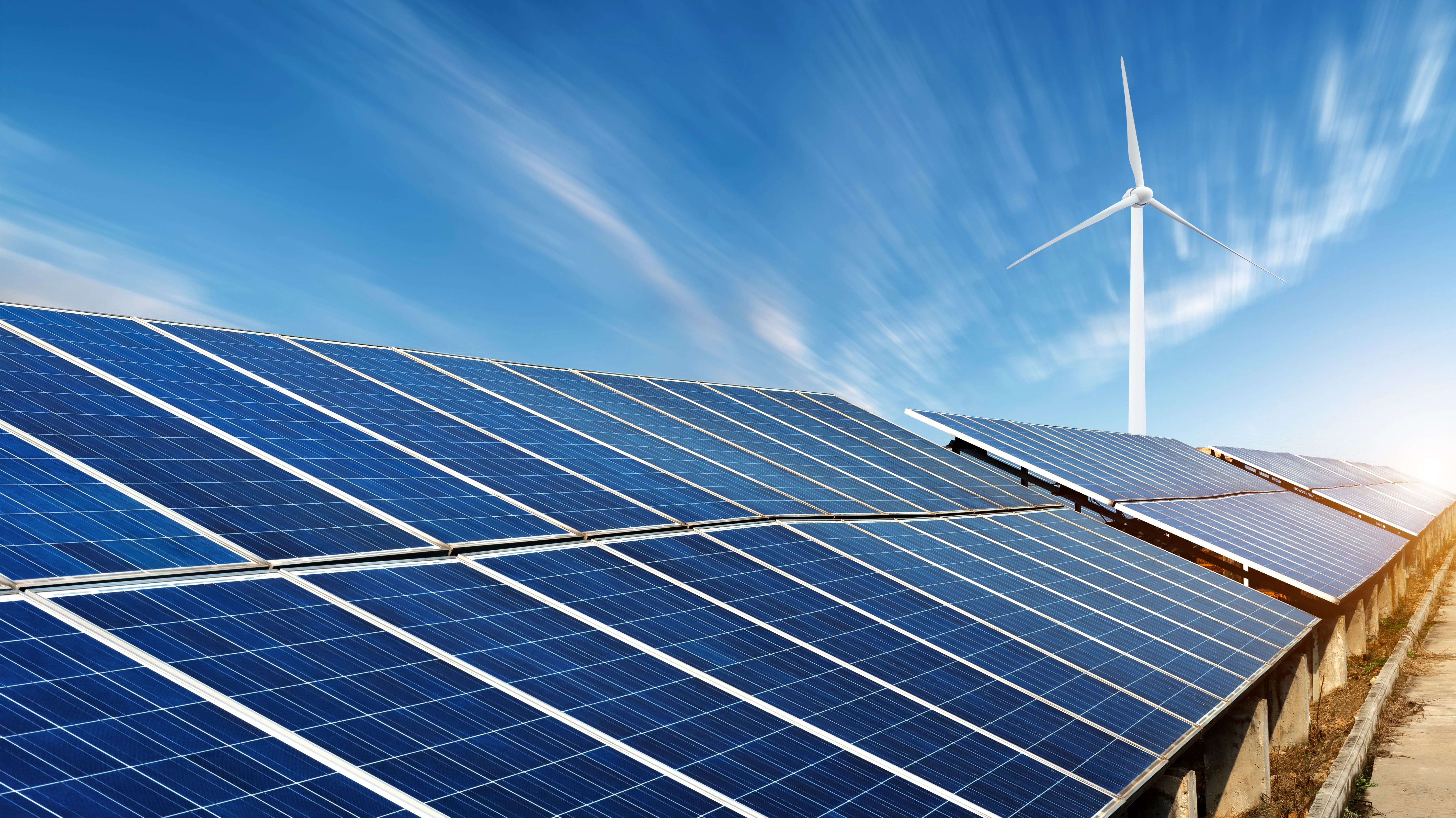 Row of Solar Panels and Single Windmill