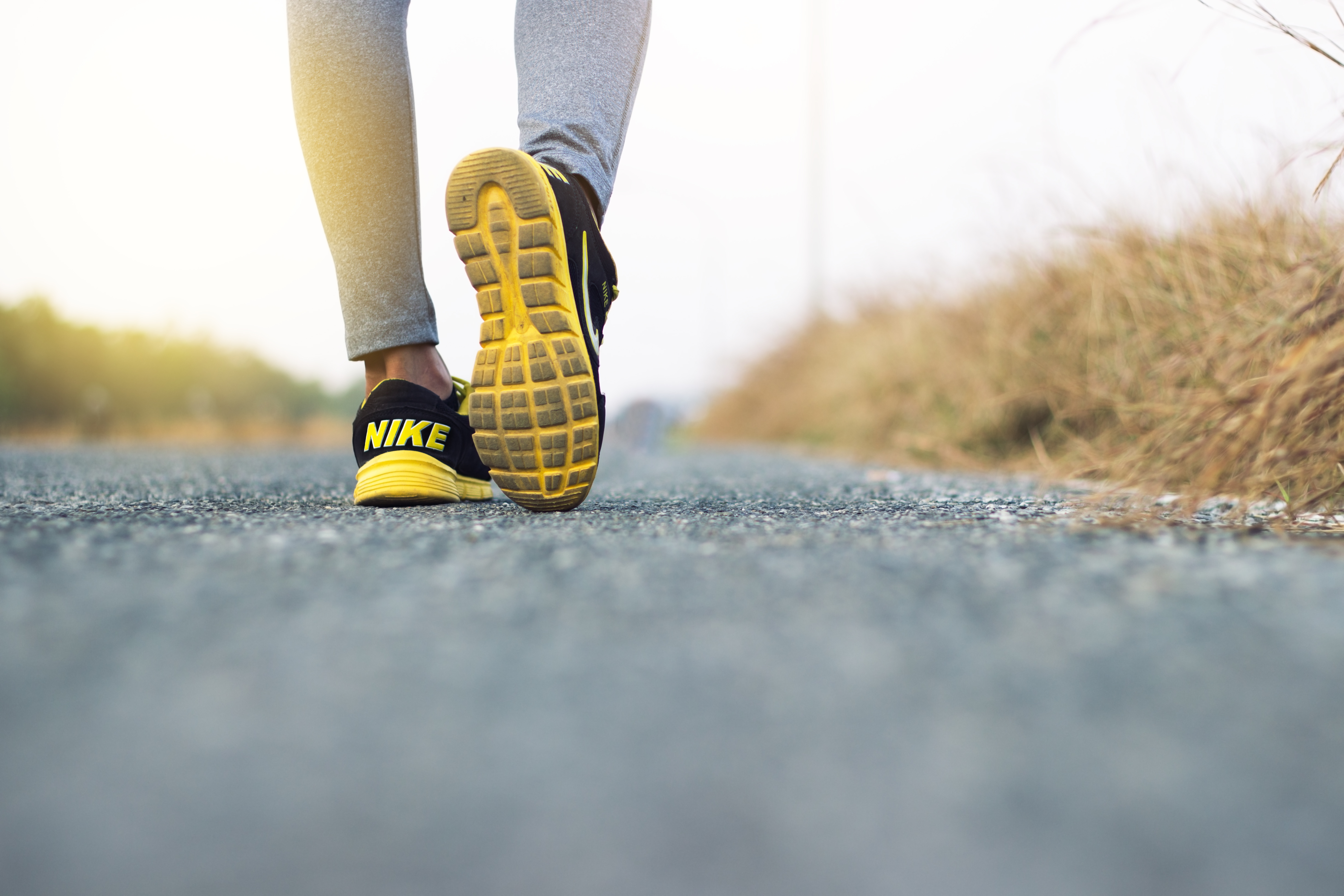 Person taking step wearing Nike shoes