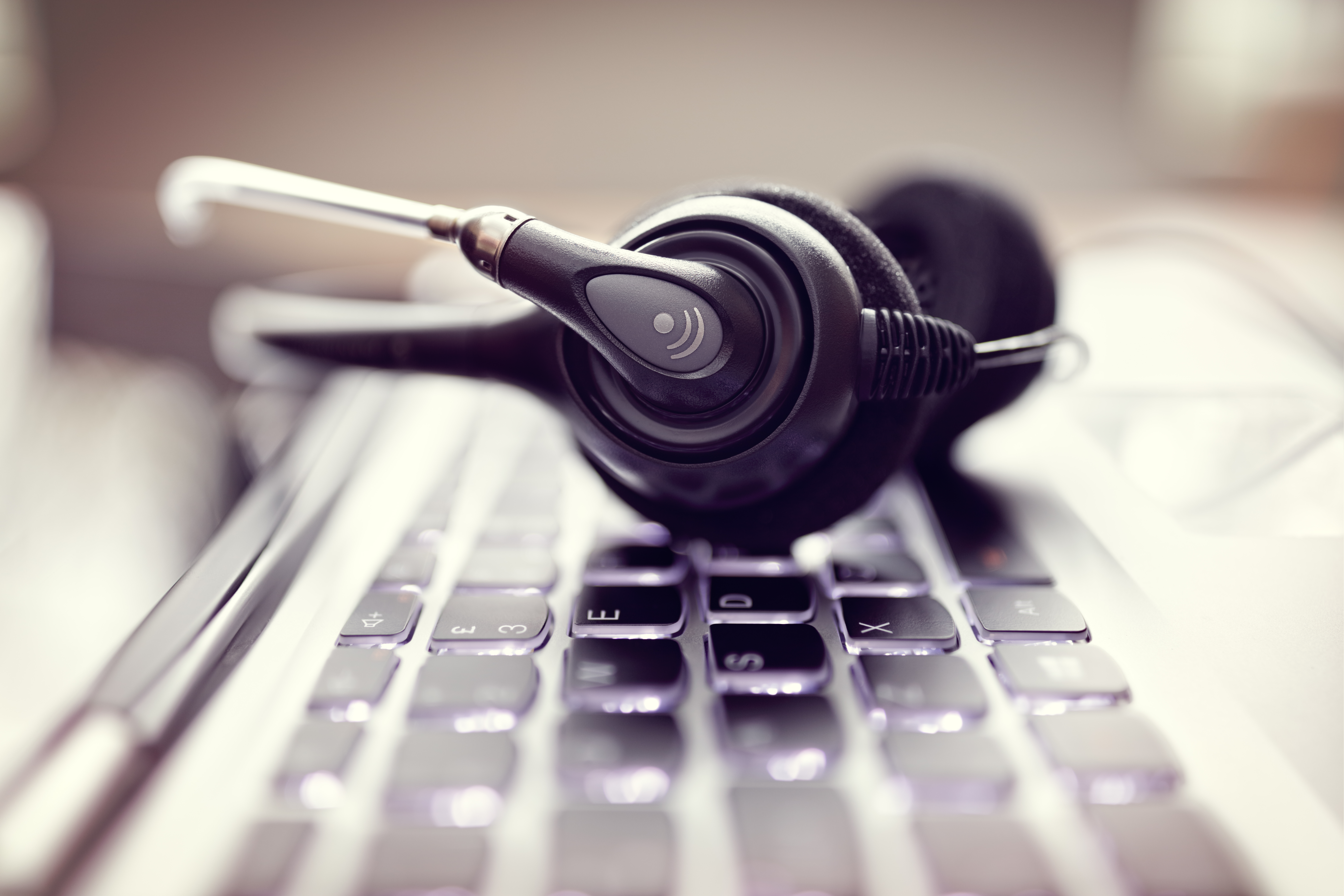 headphone set laying on keyboard