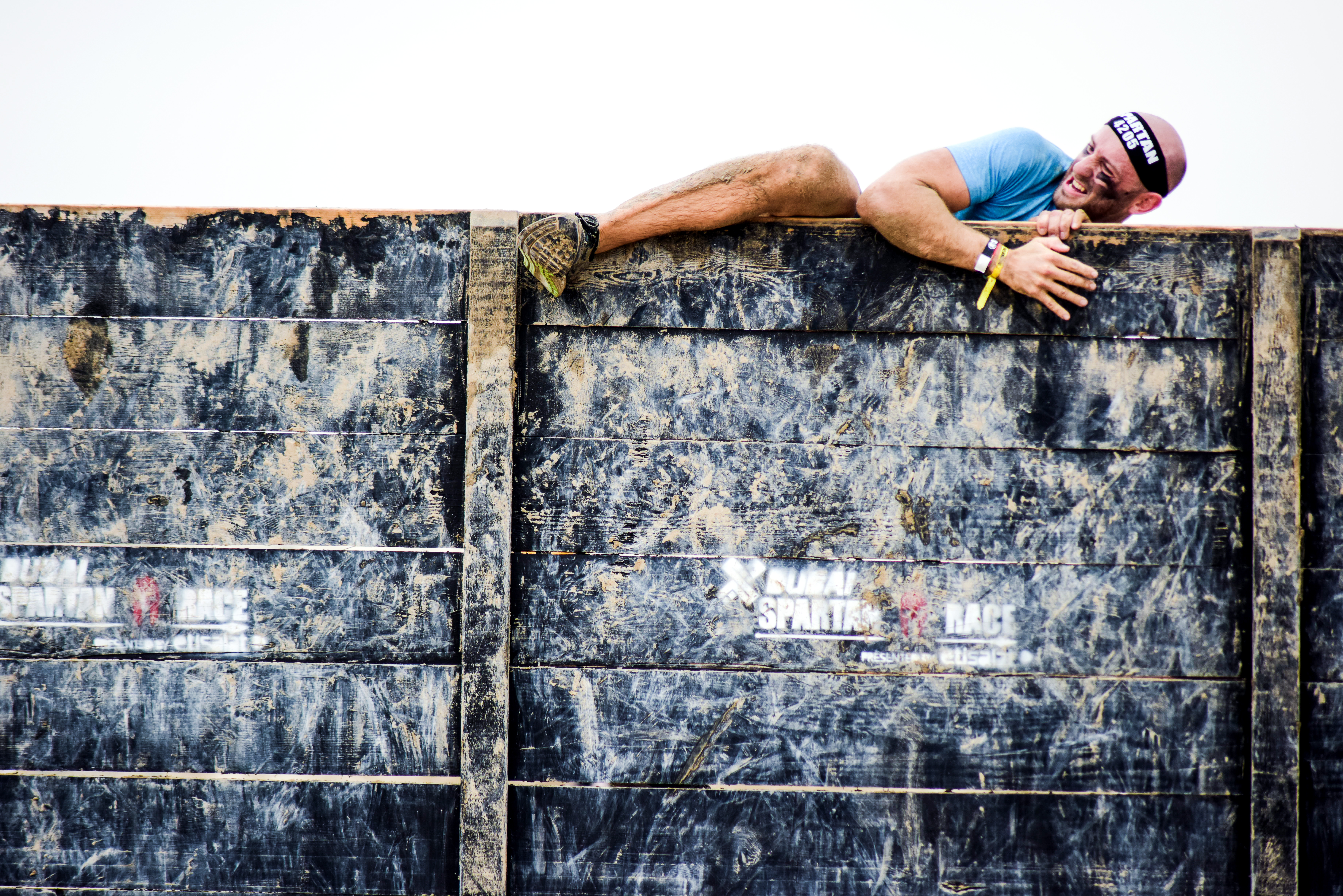 Person climbing over wall