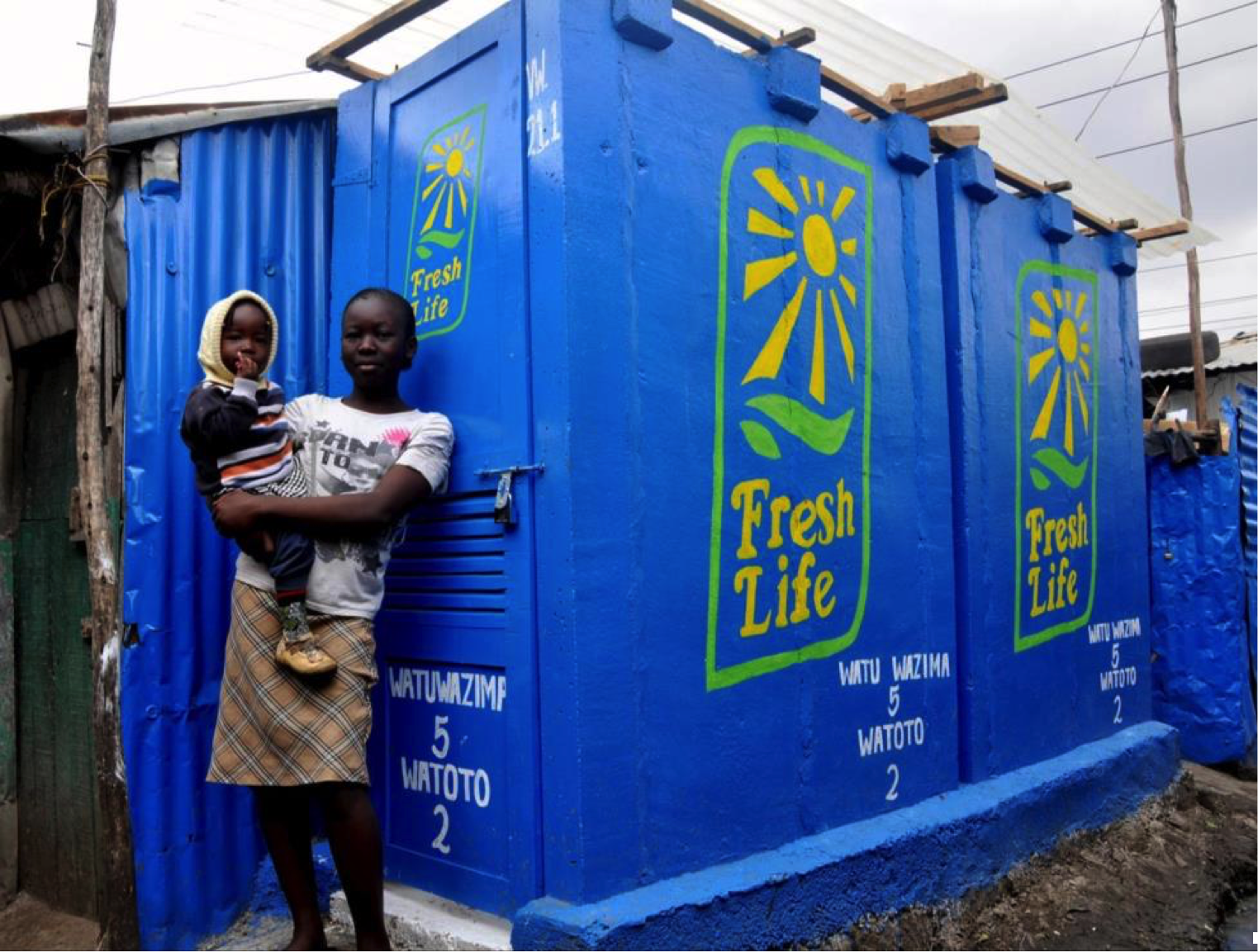 adult and child standing in front of container