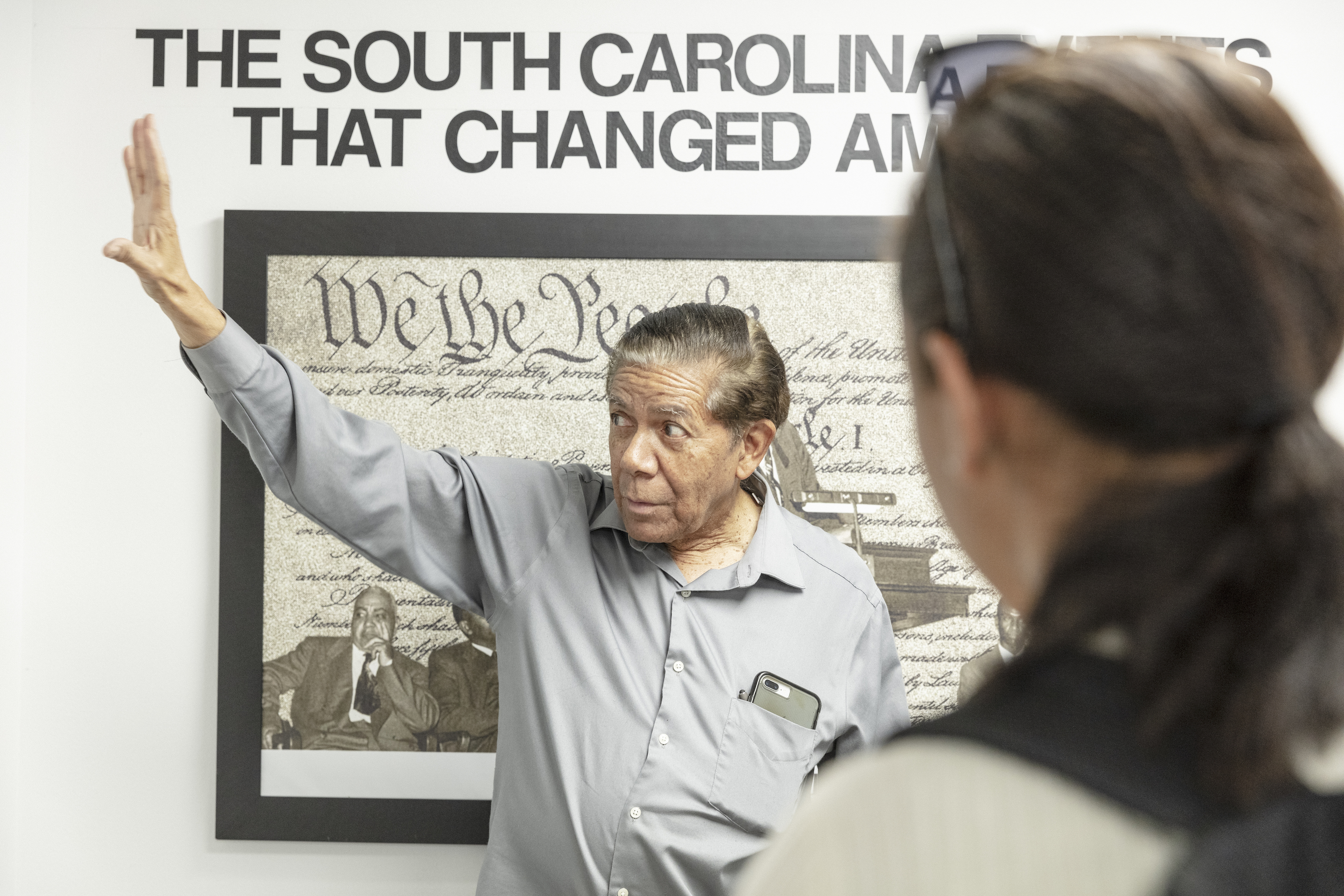 Cecil Williams showing an exhibit in his civil rights museum to USA Lab students