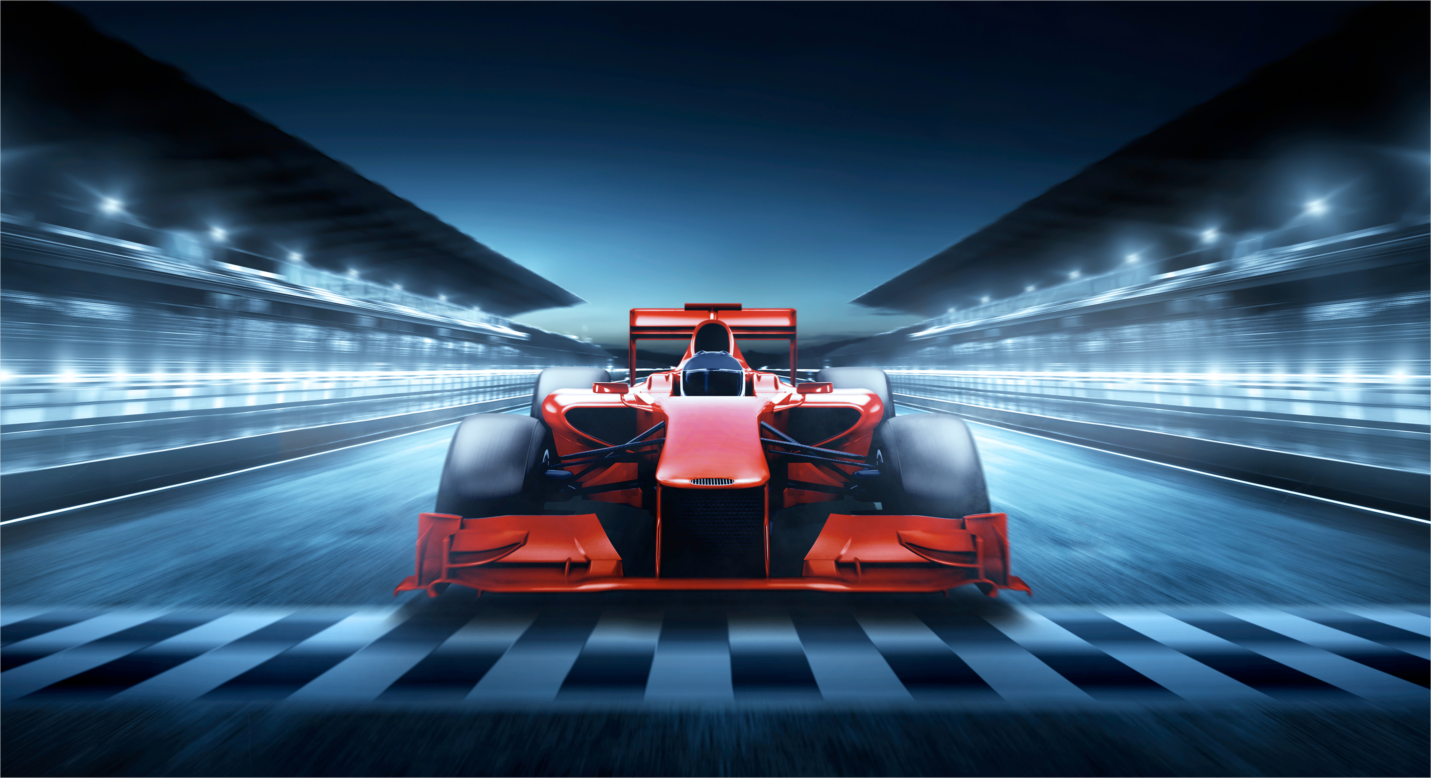 Image of a Formula 1 car racing at night.