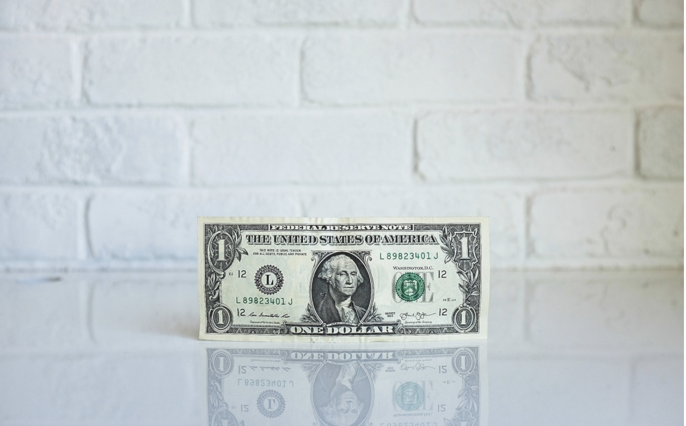 Picture of dollar bill standing up on its edge