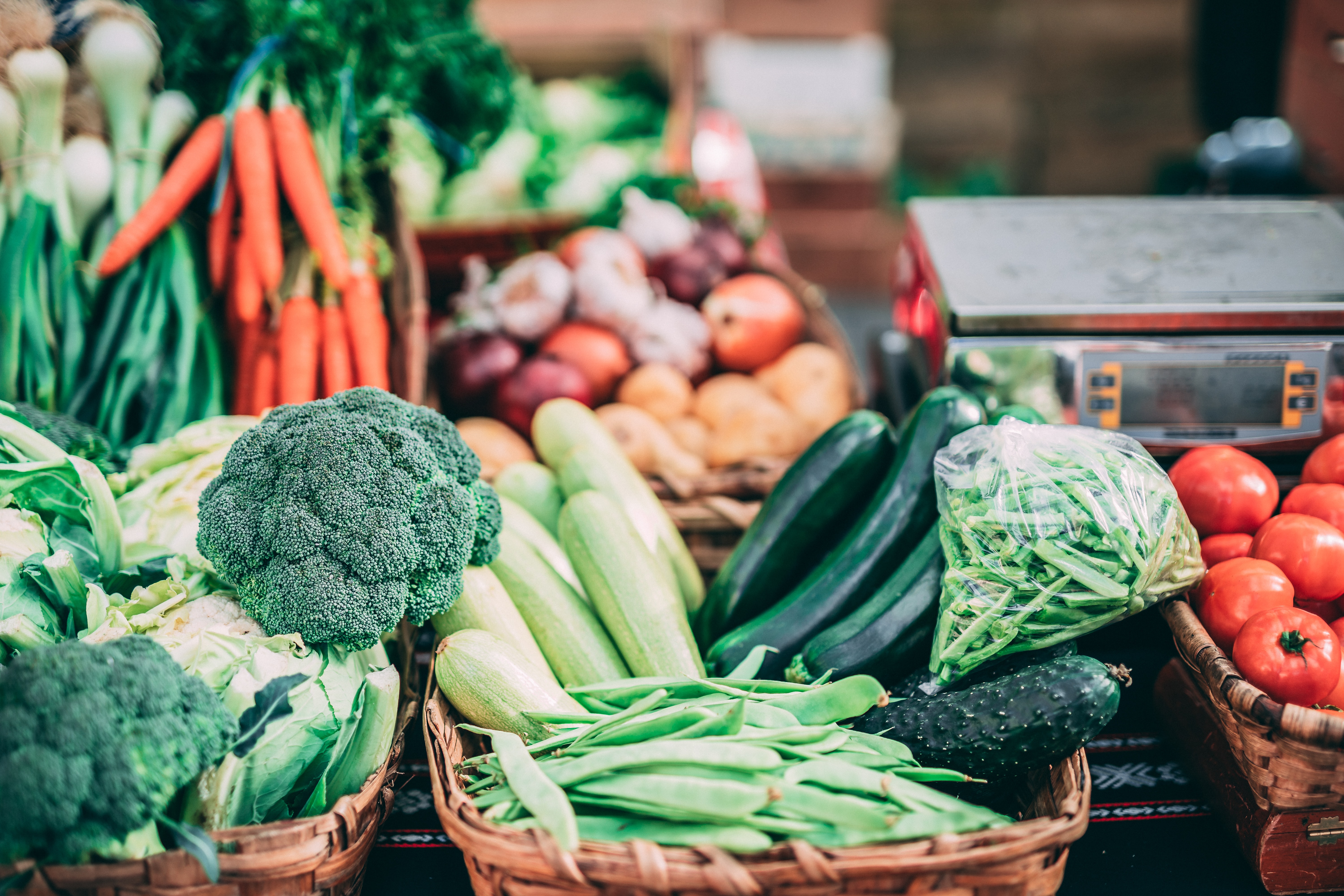 A variety of produce in wicker baskets