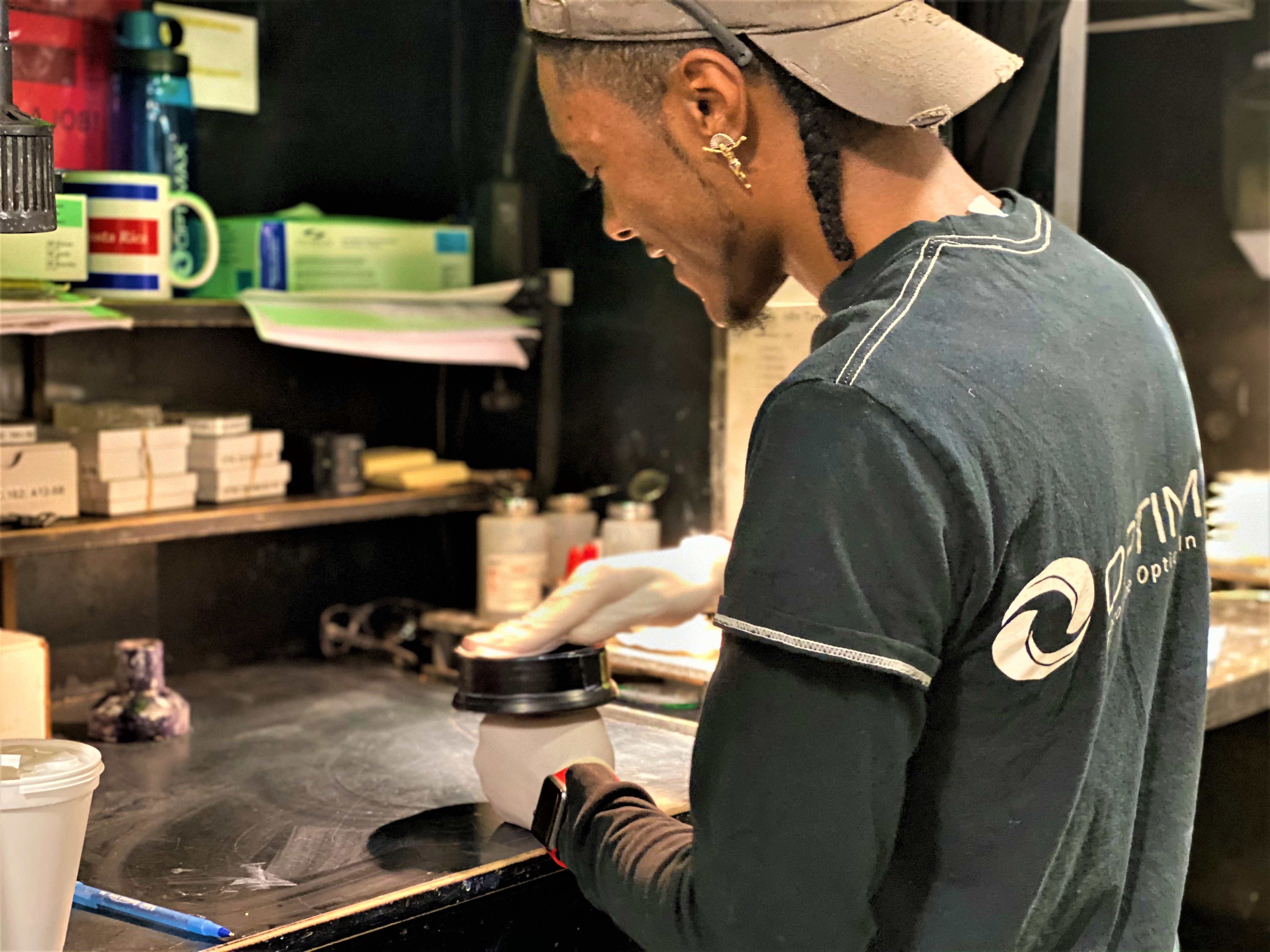 Optimax employee working