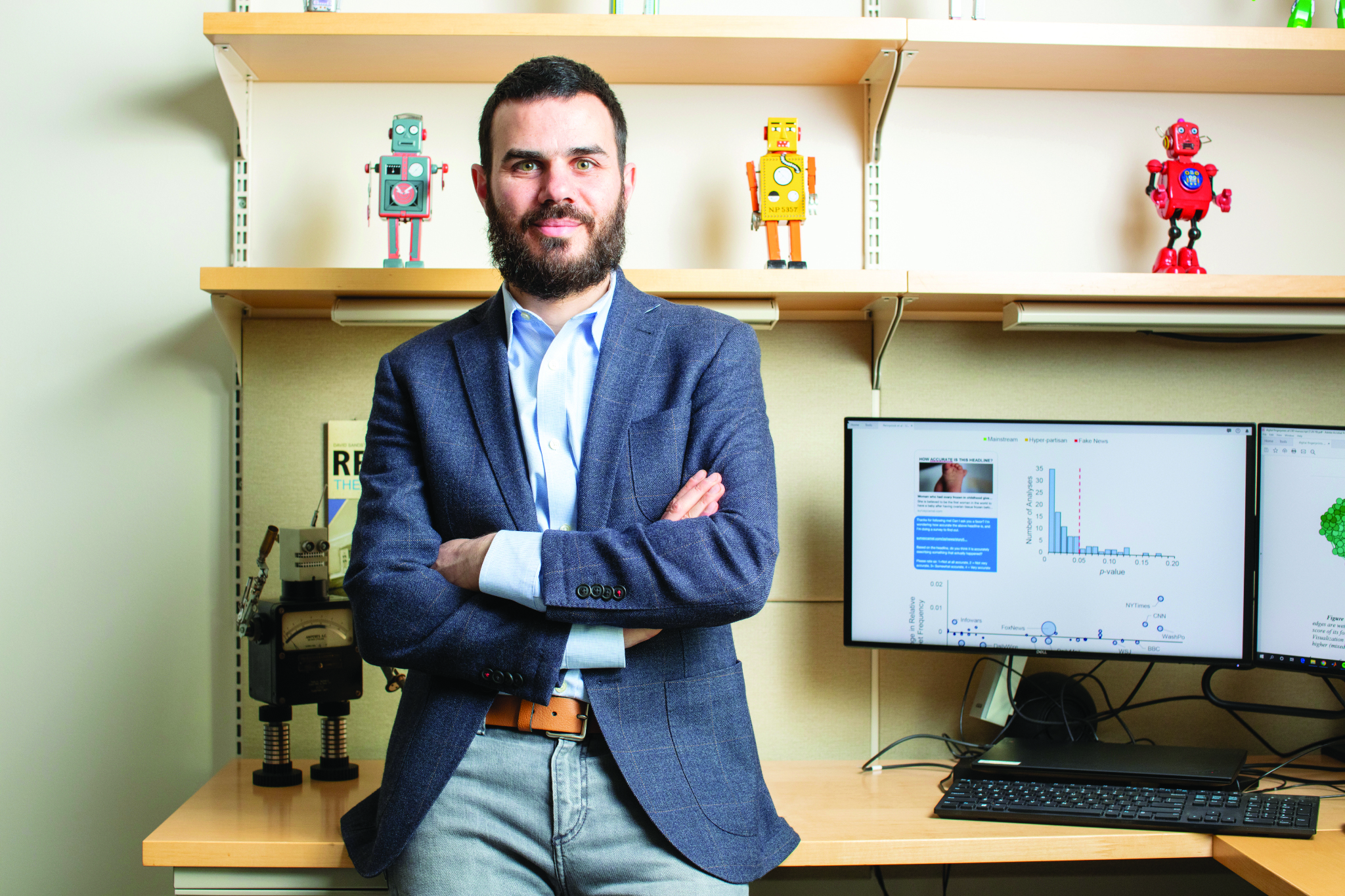 David Rand standing in front of desk