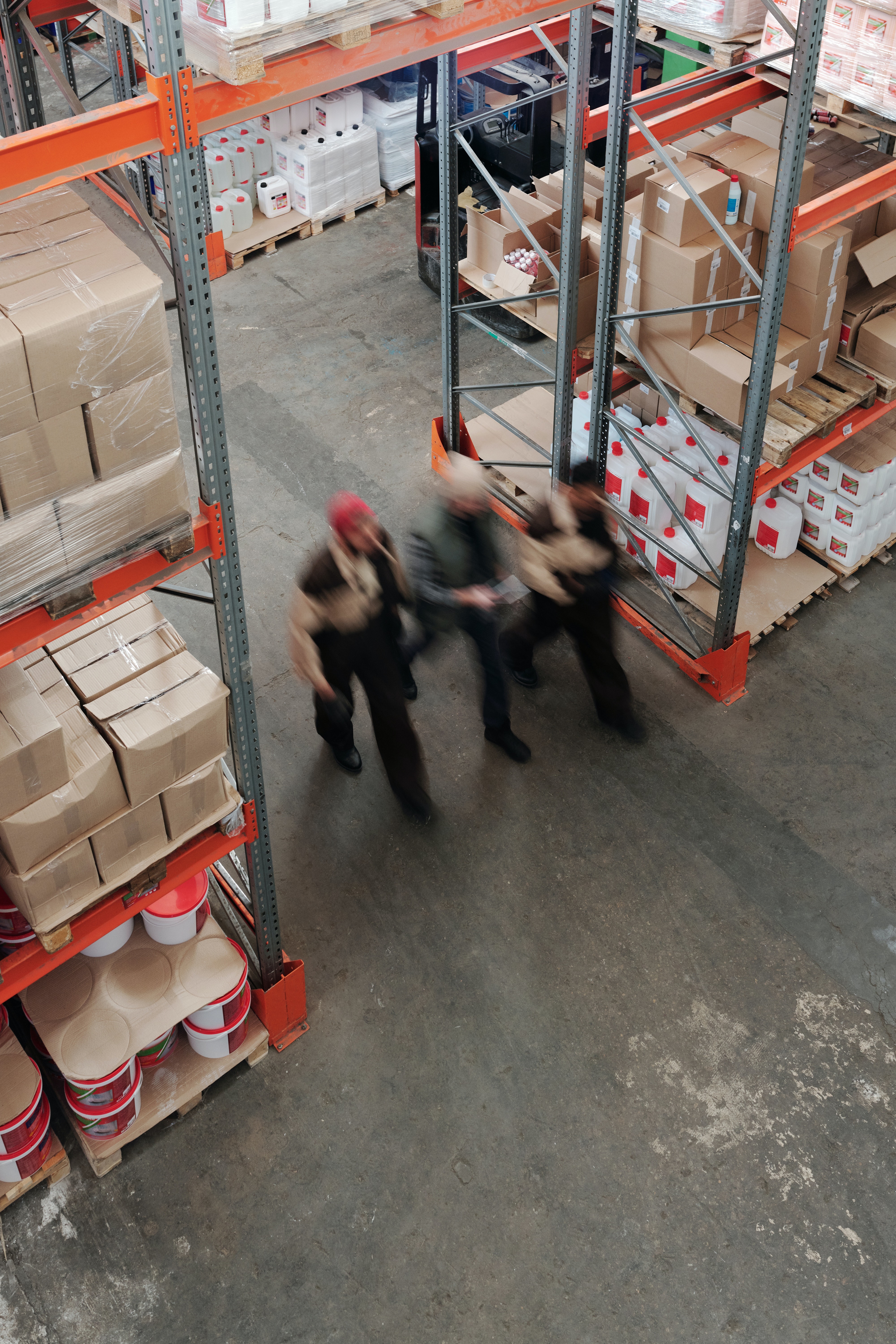 Workers walking through warehouse