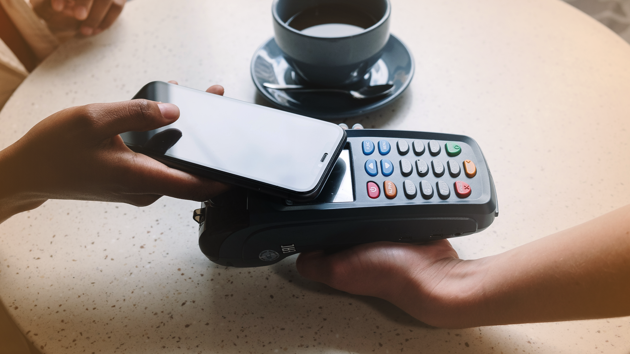 Person scanning mobile pay on credit card processor