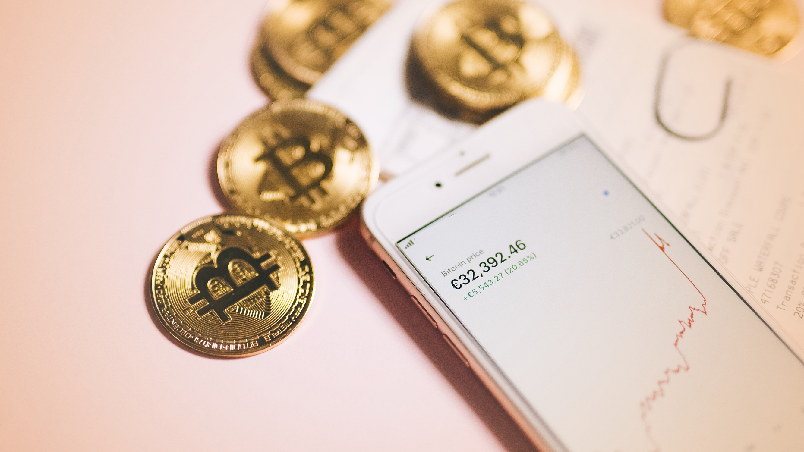 Bitcoins and smartphone showing cryptocurrency trends in the stock market