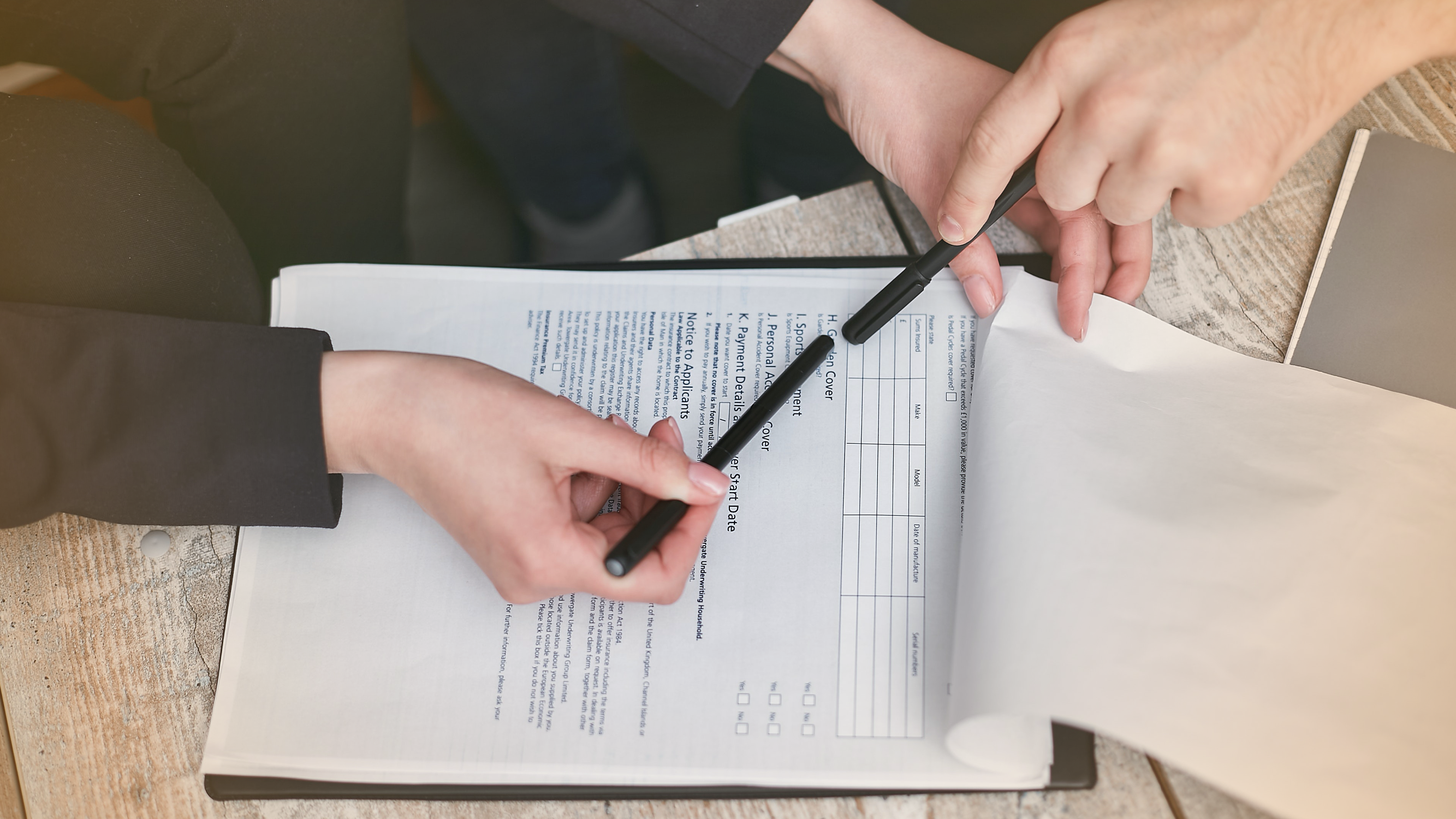 Two borrowers reviewing a line of credit contract