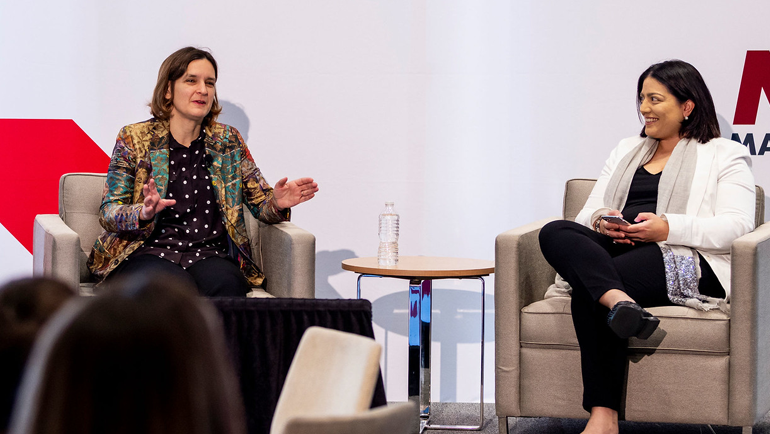 Esther Duflo and Tavneet Suri on stage at MIT Sloan Women's Conference