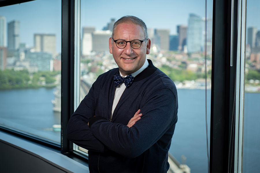 Photo of Steven Spear with Boston skyline in the background