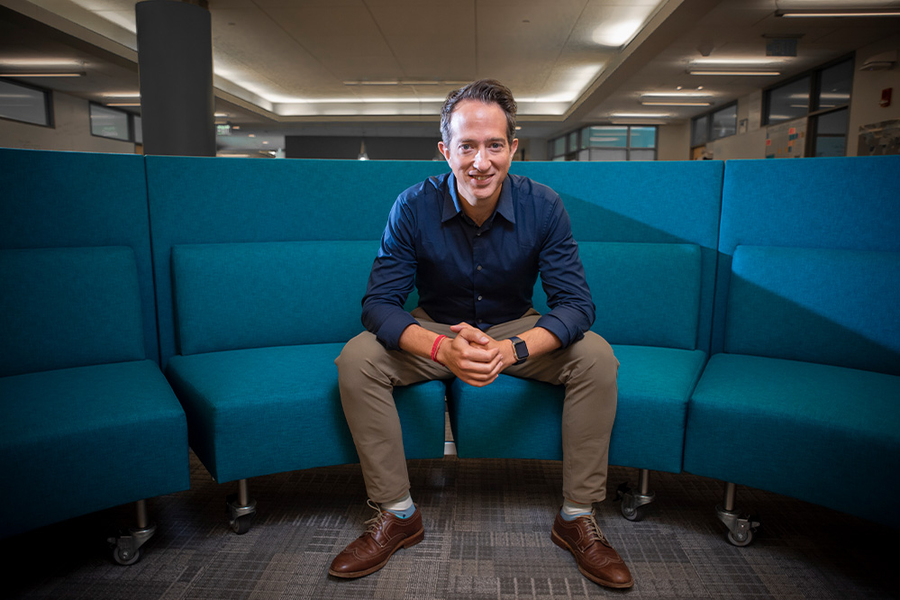 Jason Jay poses for a photo at MIT Sloan