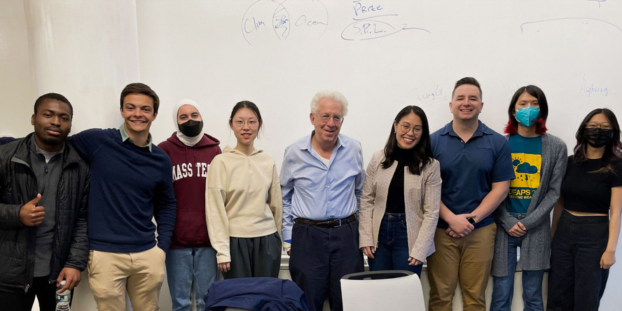 Bob Pozen poses with students in the Pozen Fellowship program