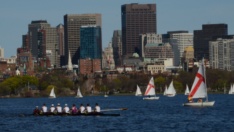 Rowers and sail boats on the Charles River