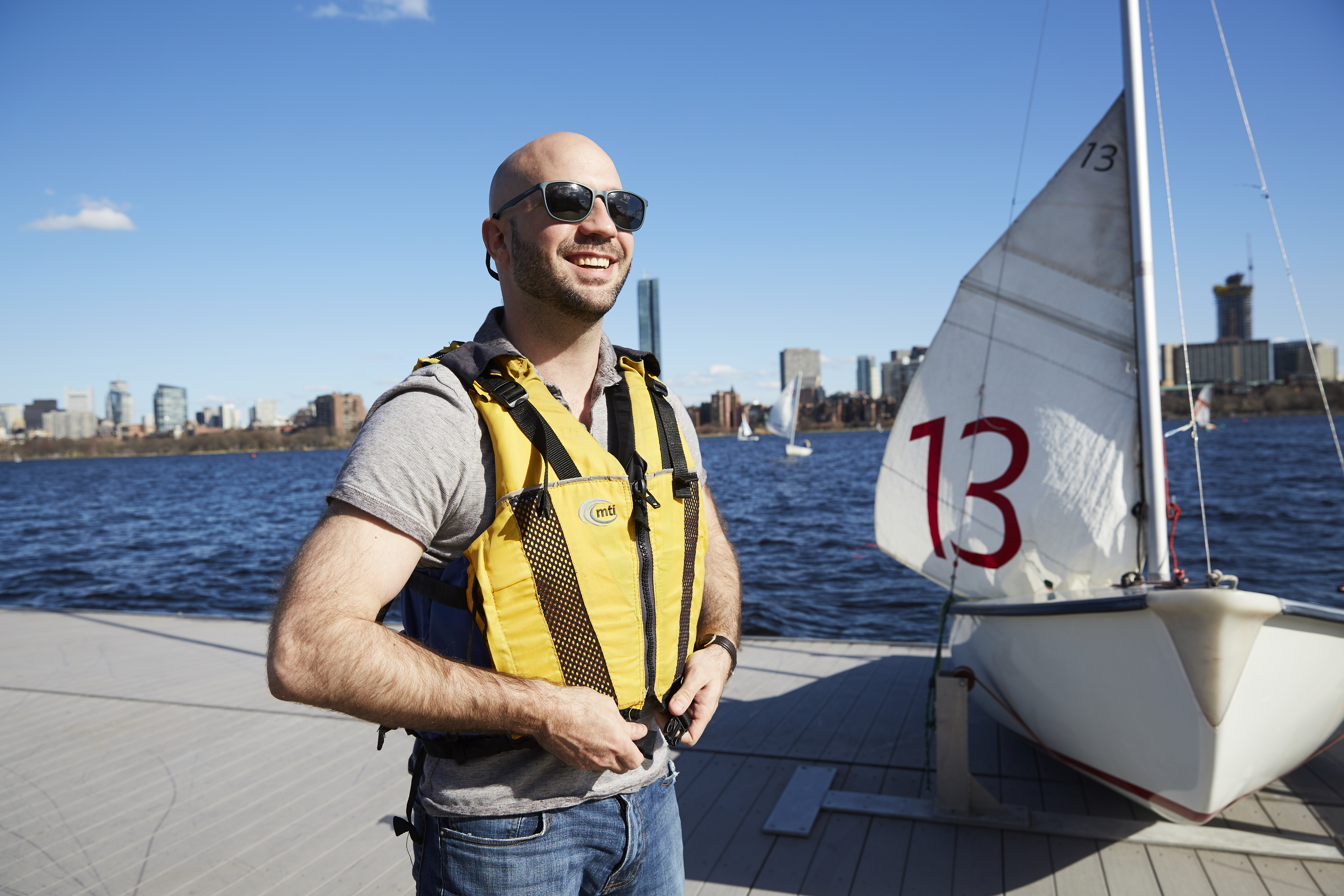 Student preparing to sail at MIT's Sailing Pavilion