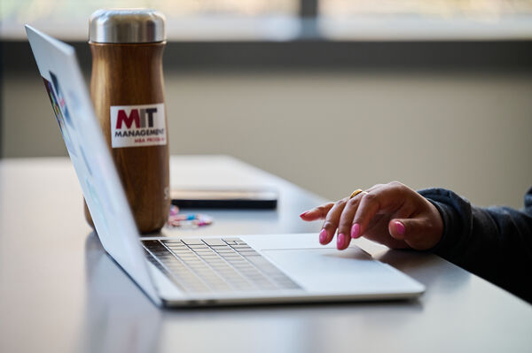 Laptop and water bottle on a desk