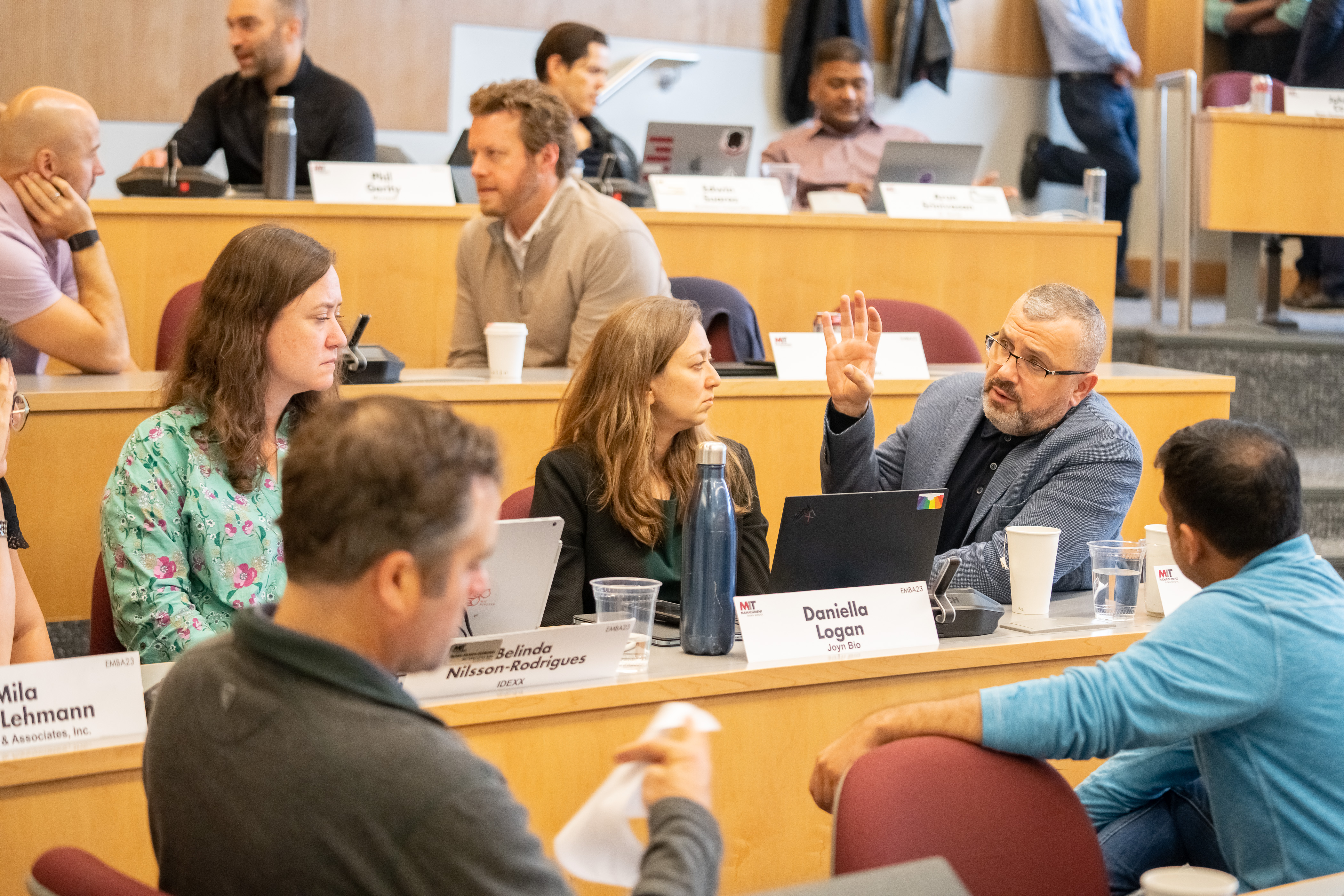 EMBA '23 students having a discussion in class