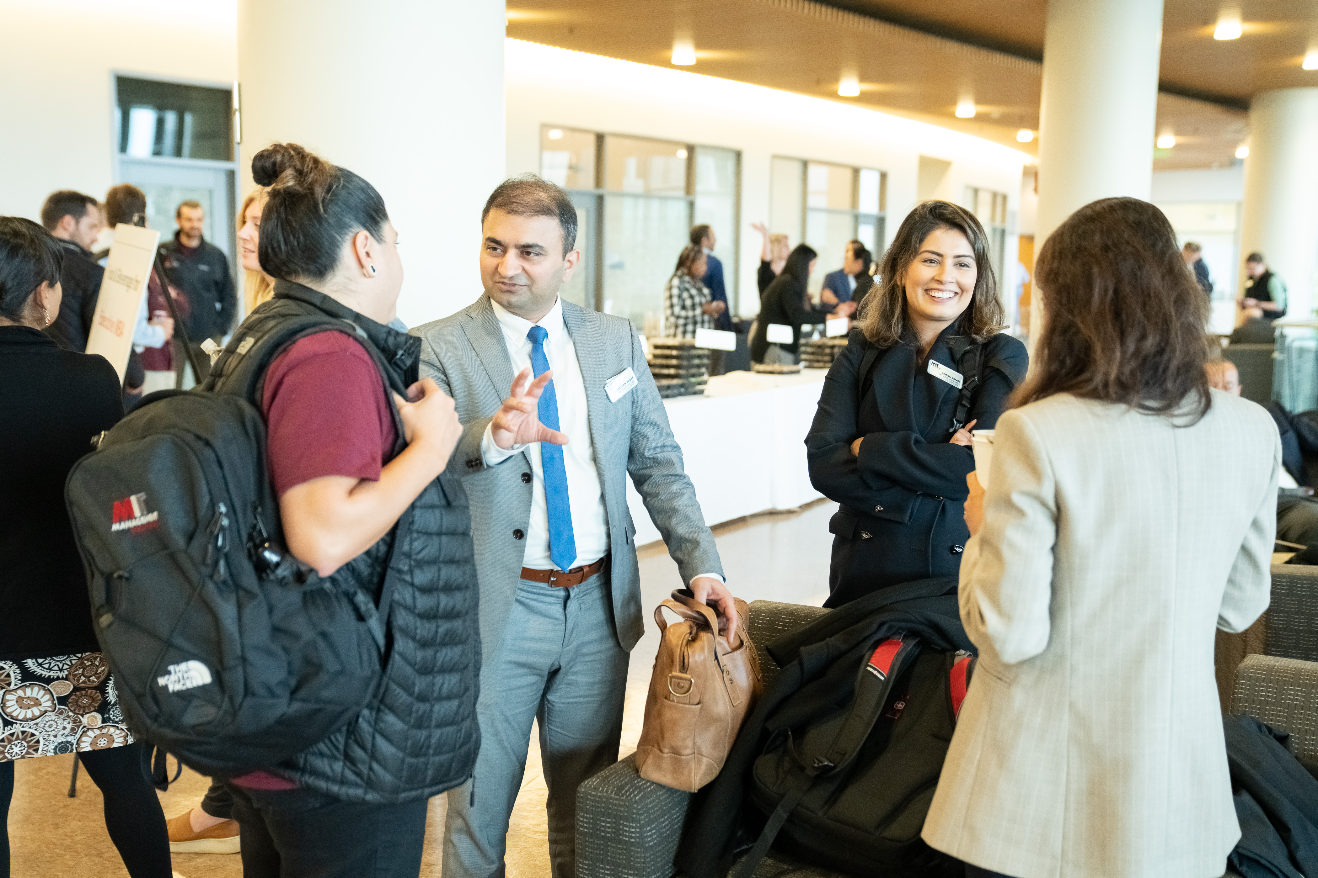 EMBA '24 students in a small group talking