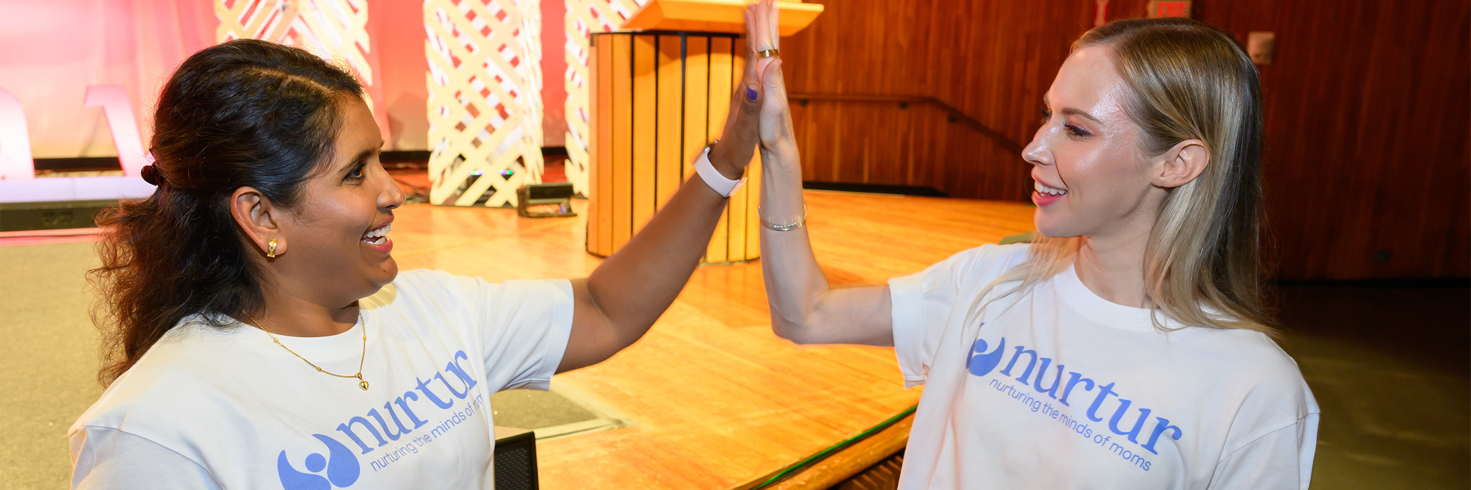 nutur cofounders Bindu Chanagala and Kristen Ellefson give one another a high-five