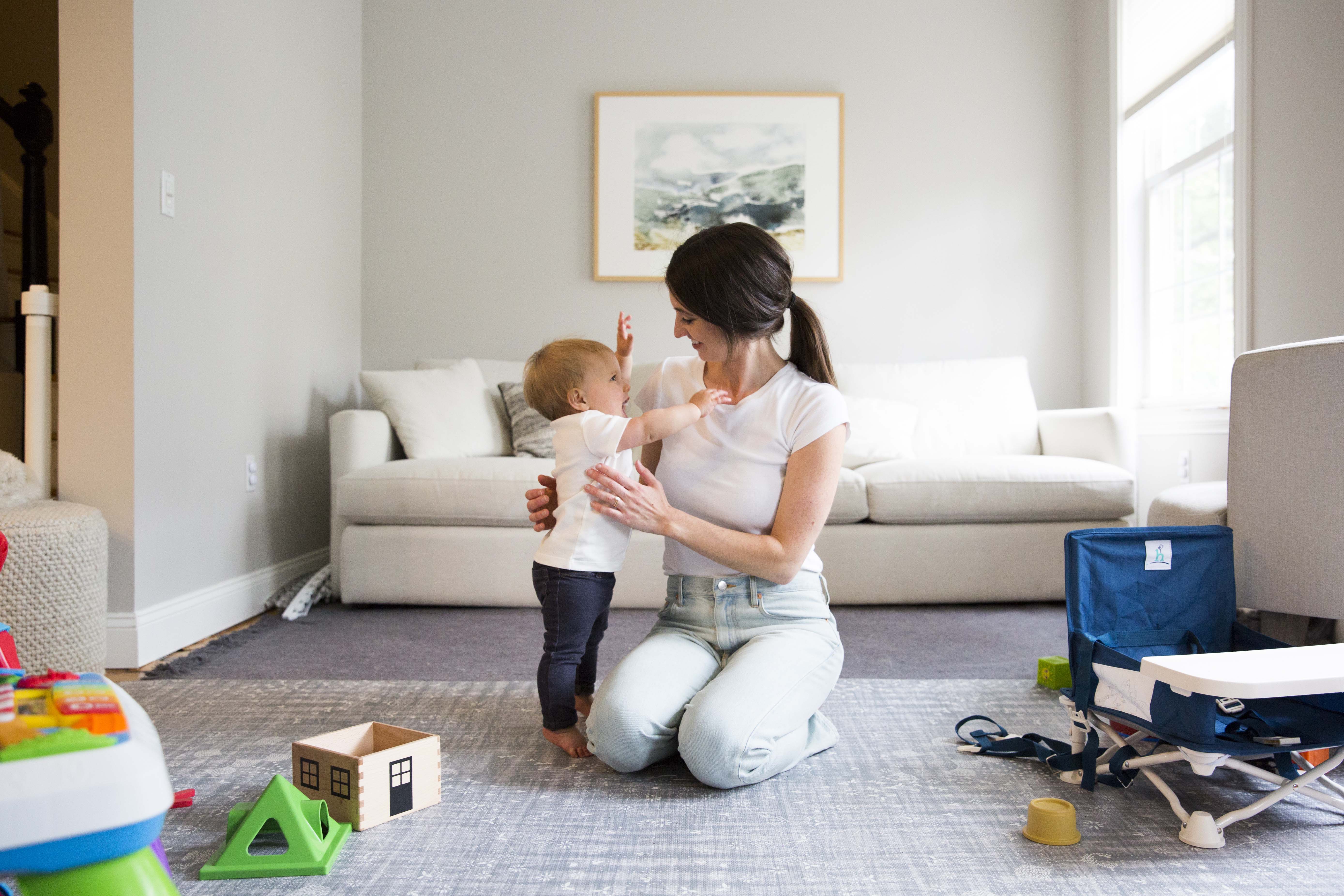 A mother and baby play together