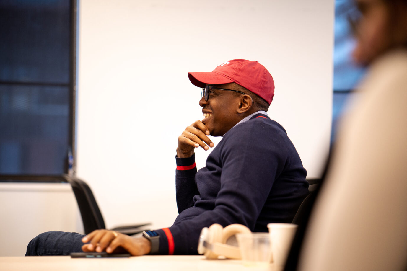 Program participants in the classroom smiling