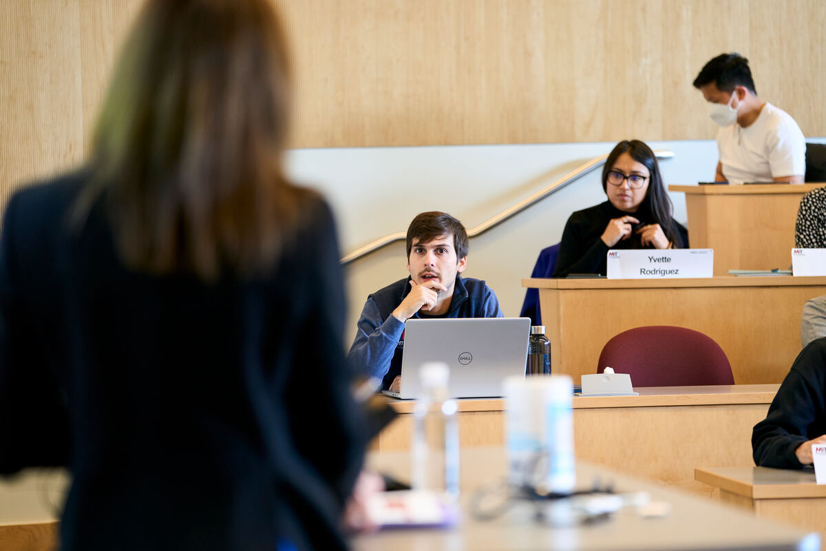 a woman teaching to a classroom