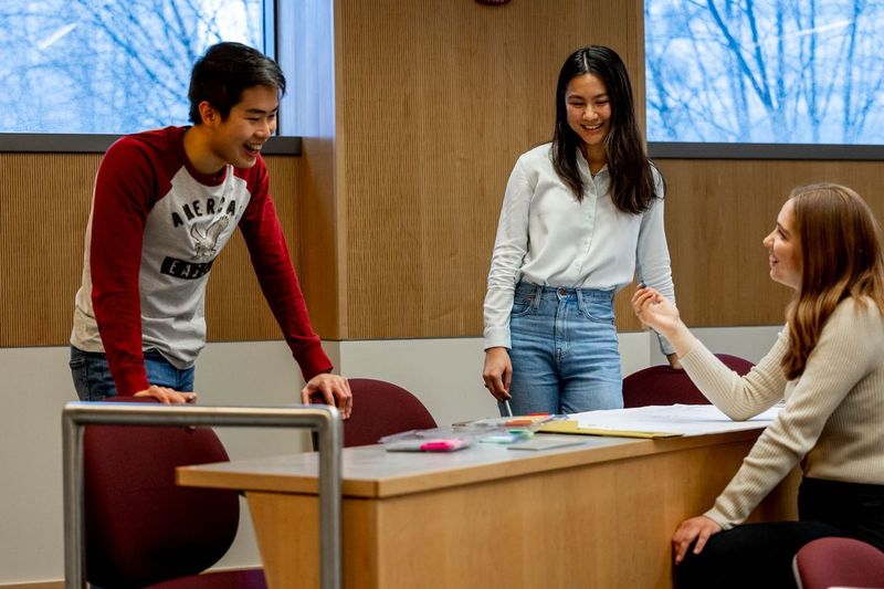 Three undergraduate students collaborate on a project