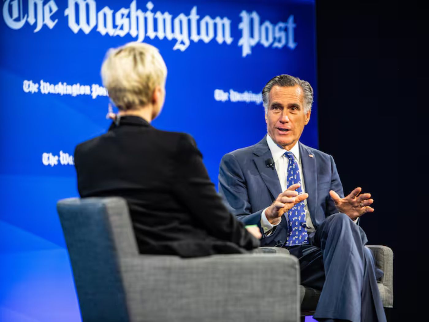 Sen. Mitt Romney, R-Utah, talks to Washington Post political reporter Leigh Ann Caldwell, left, during a Washington Post discussion on climate change on Thursday, Dec. 8, 2022, in Washington.