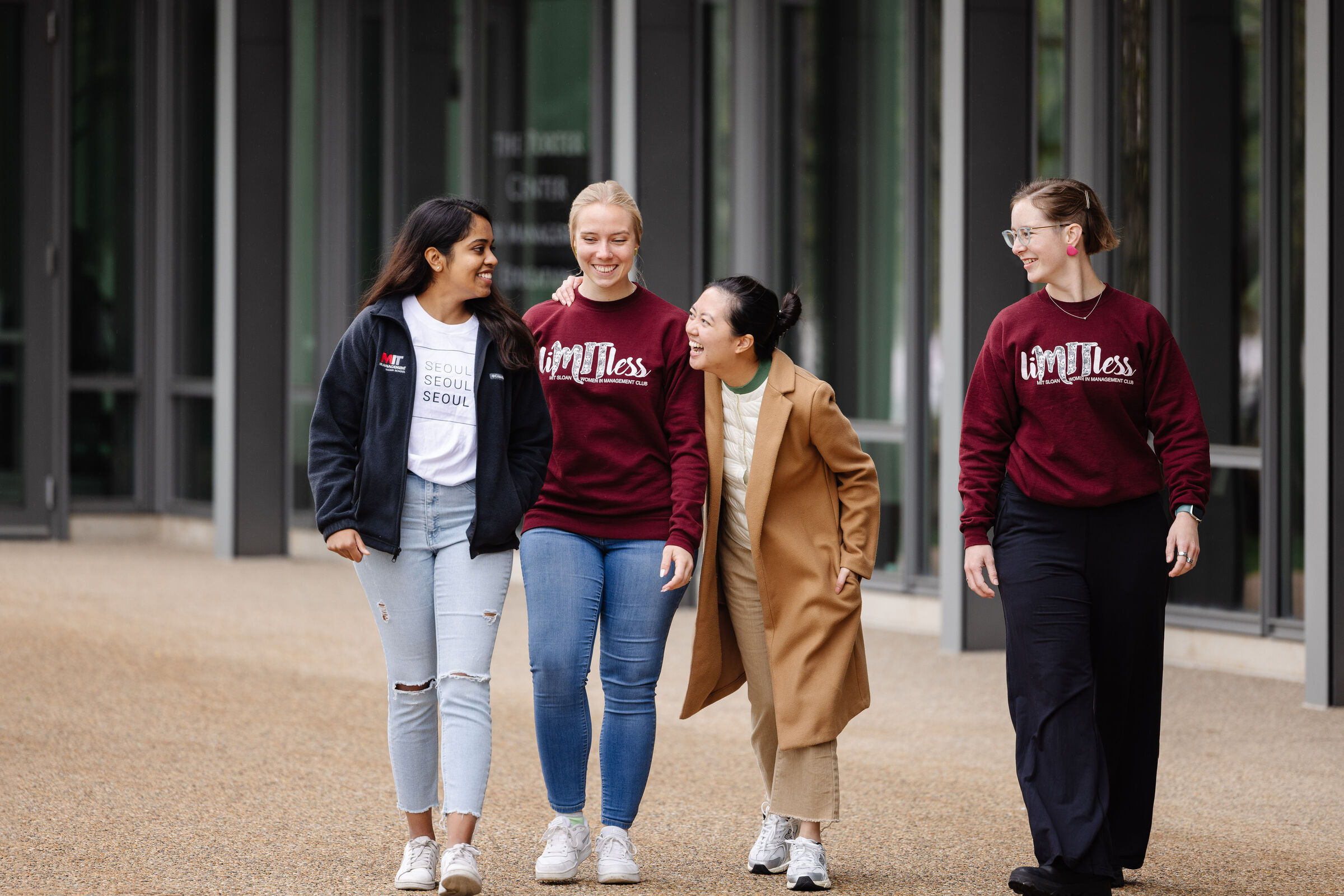 4 students from SWIM club walking close together 