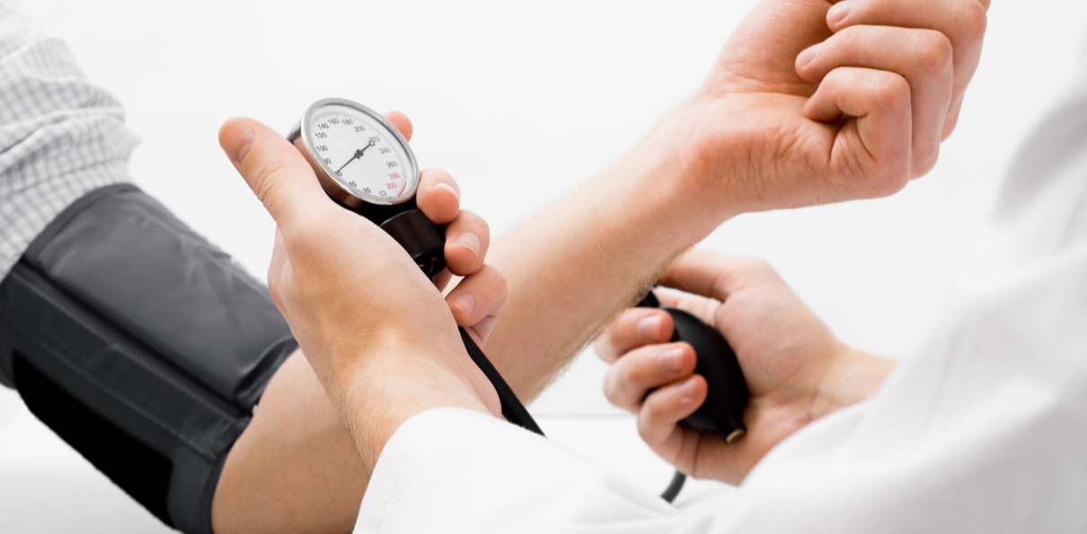 Person's arm having their blood pressure taken
