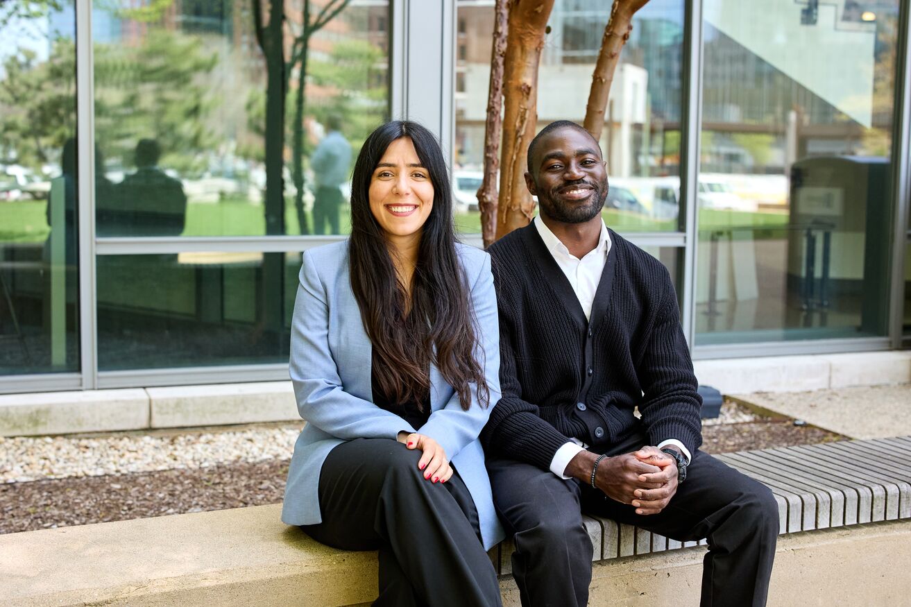 Photo for Sloan co-presidents sitting outside Sloan, Florencia Bitar and Ubong Okon-Umoren