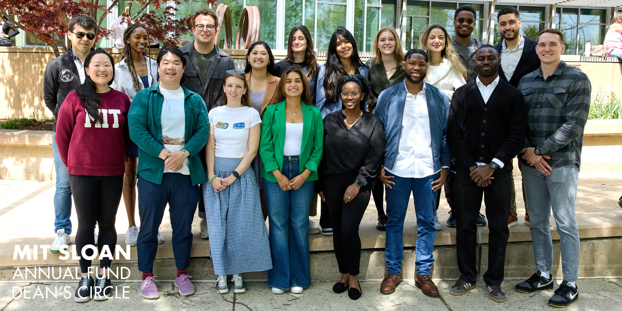Group of students standing outside of MIT Sloan building E62.