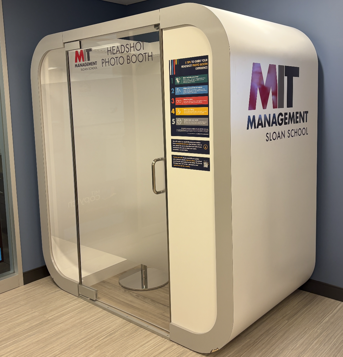Square Photo Booth with branded MIT Sloan Stickers that sits outside of STS and Copy Tech